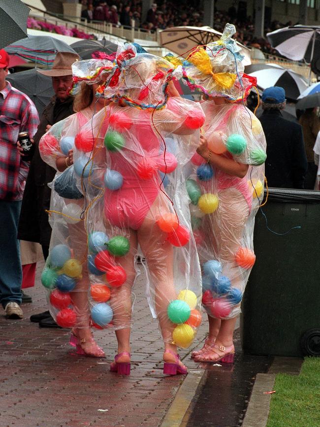 Women wear bathers and balloons in 1995.