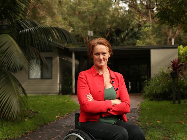 A furious member for Gosford Liesl Tesch out the front of Arts Minister Don Harwin's Pearl Beach holiday house on the Central Coast. Picture by Peter Lorimer.