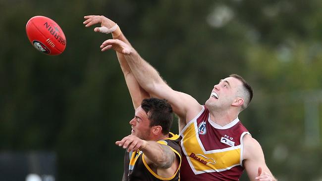 Dylan Chapman (left) of Thomastown contests ruck against Patrick Flynn of Lower Plenty during NFL footy: Thomastown v Lower Plenty on Saturday, August 11, 2018, in Epping, Victoria, Australia. Picture: Hamish Blair