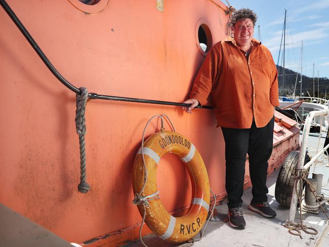 Craig Bellgrove with wooden boat MV Goondooloo, which was salvaged from the Tamar River to be restored in Hobart. Picture: Nikki Davis-Jones