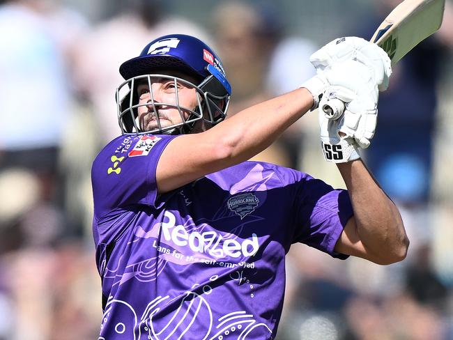 HOBART, AUSTRALIA - JANUARY 15: Tim David of the Hurricanes hits a six during the Men's Big Bash League match between the Hobart Hurricanes and the Sydney Thunder at Blundstone Arena, on January 15, 2023, in Hobart, Australia. (Photo by Steve Bell/Getty Images)