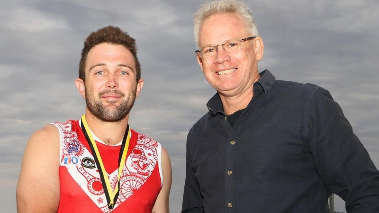 Federal captain Abe Ankers with AFLNT chairman Sean Bowden after winning the 2023 CAFL grand final. Picture: AFLNT Media