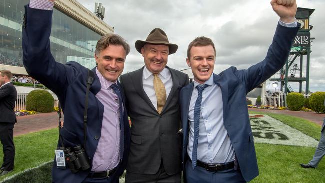 Trainers Tom Dabernig, David and Ben Hayes celebrate after winning the Melbourne Cup. Picture: Jay Town