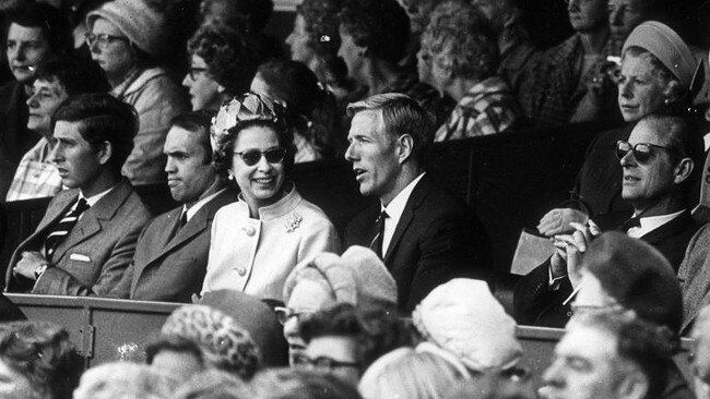 The royal guests had expert commentators as they watched the game from their enclosure. In the enclosure are Prince Charles, Ross Smith, Queen Elizabeth, John Schultz, Prince Philip and Ross Dillon.