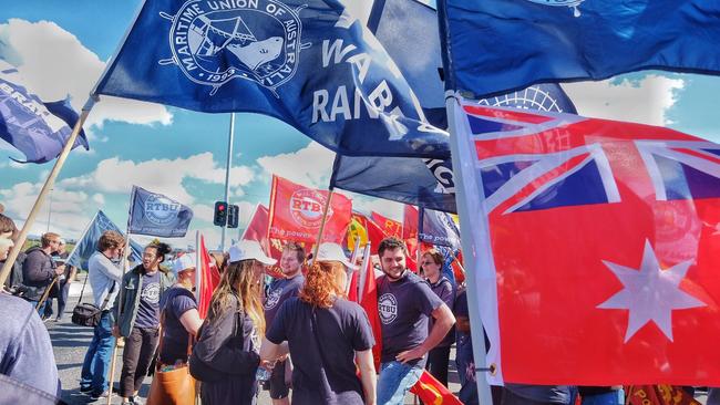 Union members march to Webb Dock during the industrial action dispute. Picture: AAP Image, Luis Enrique Ascui.