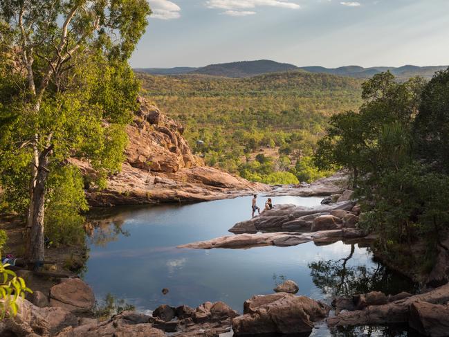 ESCAPE:  Visitors relaxing at Gunlom in Kakadu National Park.Covering nearly 20,000 square kilometres, Kakadu National Park is teeming with wildlife, home to important Aboriginal rock art sites, and takes in diverse and exotic landscape. Picture: Tourism NT/James Fisher