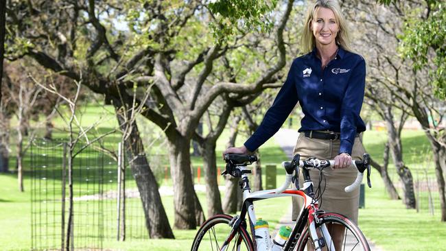 Tour Down Under women's race director Kimberley Conte poses with her bike at Rymill Park, Adelaide, Saturday, September 8th, 2018. Kimberley reveals the 2019 Tour Down Under women's race route today. (AAP Image / Bianca De Marchi)