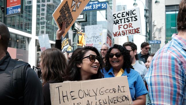 Members of the Writers Guild of America East hold signs as they walk in the picket-line outside of HBO and Amazon's offices in New York City. Picture: Getty Images