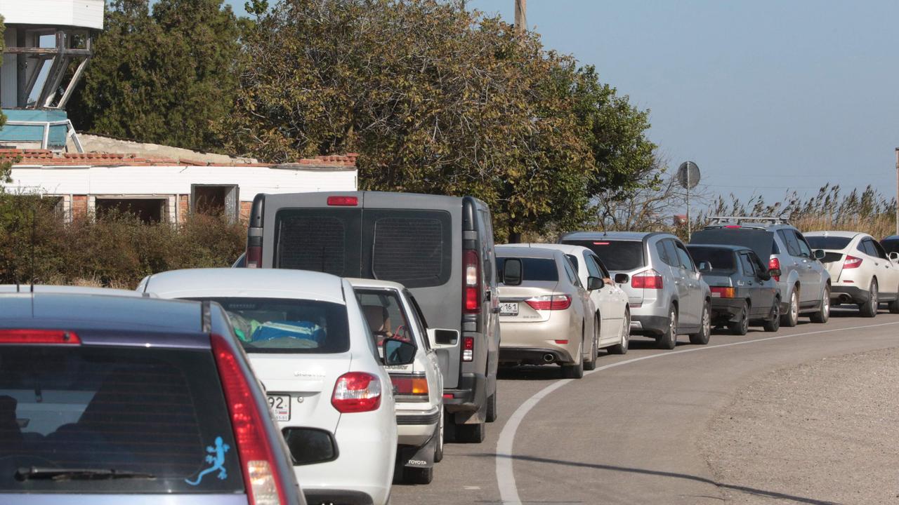 People wait in their cars for the ferry. Picture: AFP