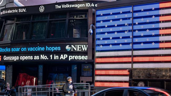 An electronic billboard in Times Square announces "stocks soar on vaccine hopes" on November 9, 2020 in New York City. Picture: Getty Images