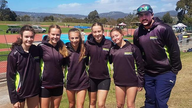 Athletics Coach Simon Bennett with athletes at the Domain Athletics Centre in Hobart.