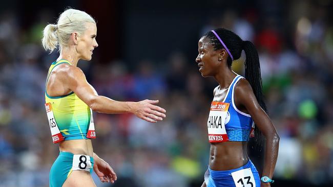 Lineo Chaka of Lesotho (right) is greeted by Eloise Wellings of Australia after the women’s 10,000m. Photo: Getty Images