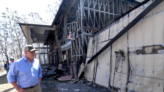 Prime Minister Scott Morrison inspecting ruins at Binna Burra after the fierce fire tore through. Picture: AAP