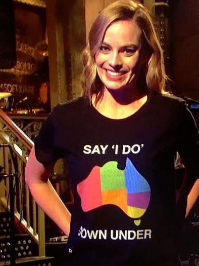 Margot Robbie wearing a Say I Do Down Under T-shirt while hosting Saturday Night Live. Picture: Supplied