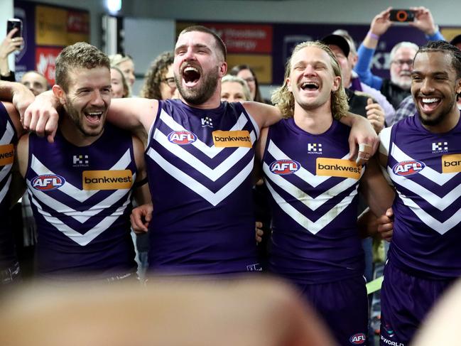 Fremantle players soak up their upset win. Picture: Jason McCawley/AFL Photos/via Getty Images