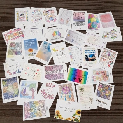 Kilbreda College Year 7 student Evie stuck dozens of positivity posters around Mentone to help spread happiness amid the coronavirus crisis. Photo: Supplied