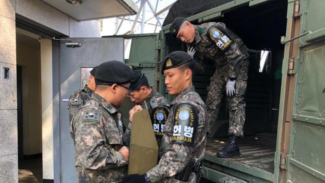 South Korean troops disarm Panmunjom. Picture: AP