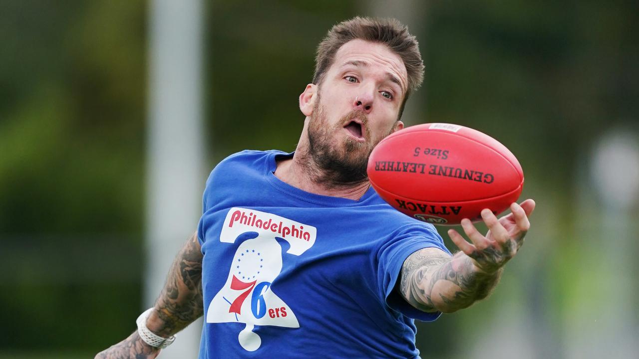 Dane Swan with footy in hand. Photo: AAP Image/Michael Dodge