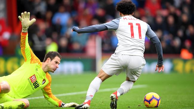 Salah skips past Asmir Begovic to score.