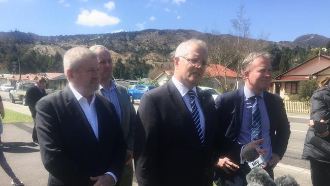 Prime Minister Scott Morrison, centre, taking in the sights of Queenstown with Tasmanian Premier Will Hodgman, right.