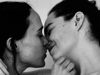 Elliot Page (left) and wife Emma Portner posed for this intimate pic last year.