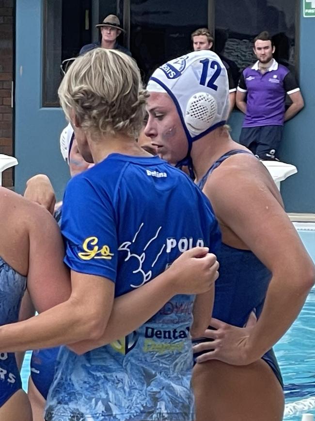 Amelia Watt, right, listens to her Polo Bears St Rita's coach Naomi McCarthy on Saturday. out.