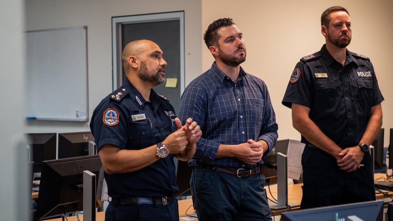 Acting Commander John Atkin (left) takes Police Minister Brent Potter through the new SerPro system while Sergeant Lewis Chown looks on. Picture: Pema Tamang Pakhrin