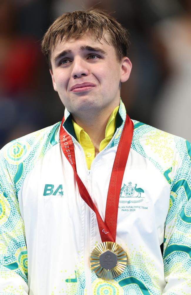 Gold medallist Callum Simpson of Team Australia reacts on the podium during the Para Swimming Men's 100m Freestyle S8 medal. Picture: Sean M. Haffey/Getty Images.