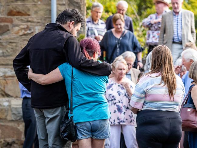 A vigil for the victims of the fatal car accident at The Royal Daylesford is held at Christ Church in Daylesford. People console each other after the ceremony. Picture: Jake Nowakowski