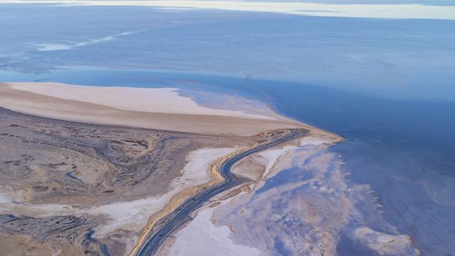 Aerial views of water swirling around Delhunty Island on Kati Thanda-Lake Eyre. Picture: Tom Putt / Wrightsair
