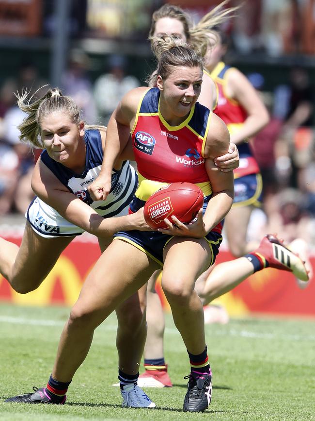 Crows Ebony Marinoff wins the ball ahead of Geelong’s Rebecca Webster on her way to 33 possessions. Picture SARAH REED