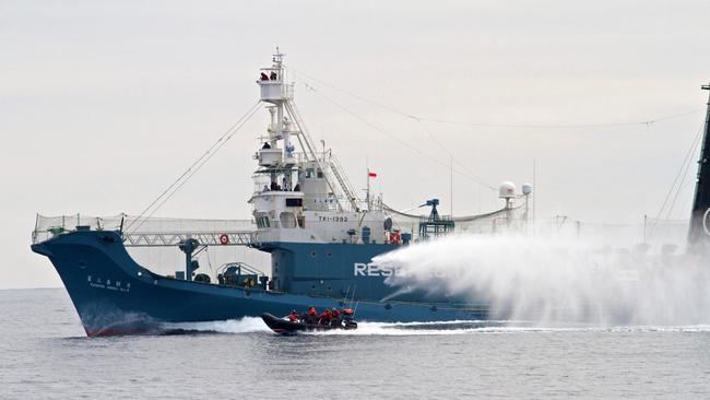 Japanese whaling ship Yushin Maru No. 3 shoots a water cannon at Sea Shepherd's inflatable boat in the Southern Ocean off Antarctica in 2011. Picture: Gary Stokes/Sea Shepherd/AP