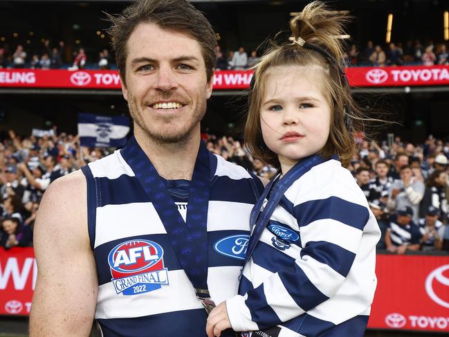 Smith and daughter Isla after the grand final win. Picture: AFL Photos/Getty Images