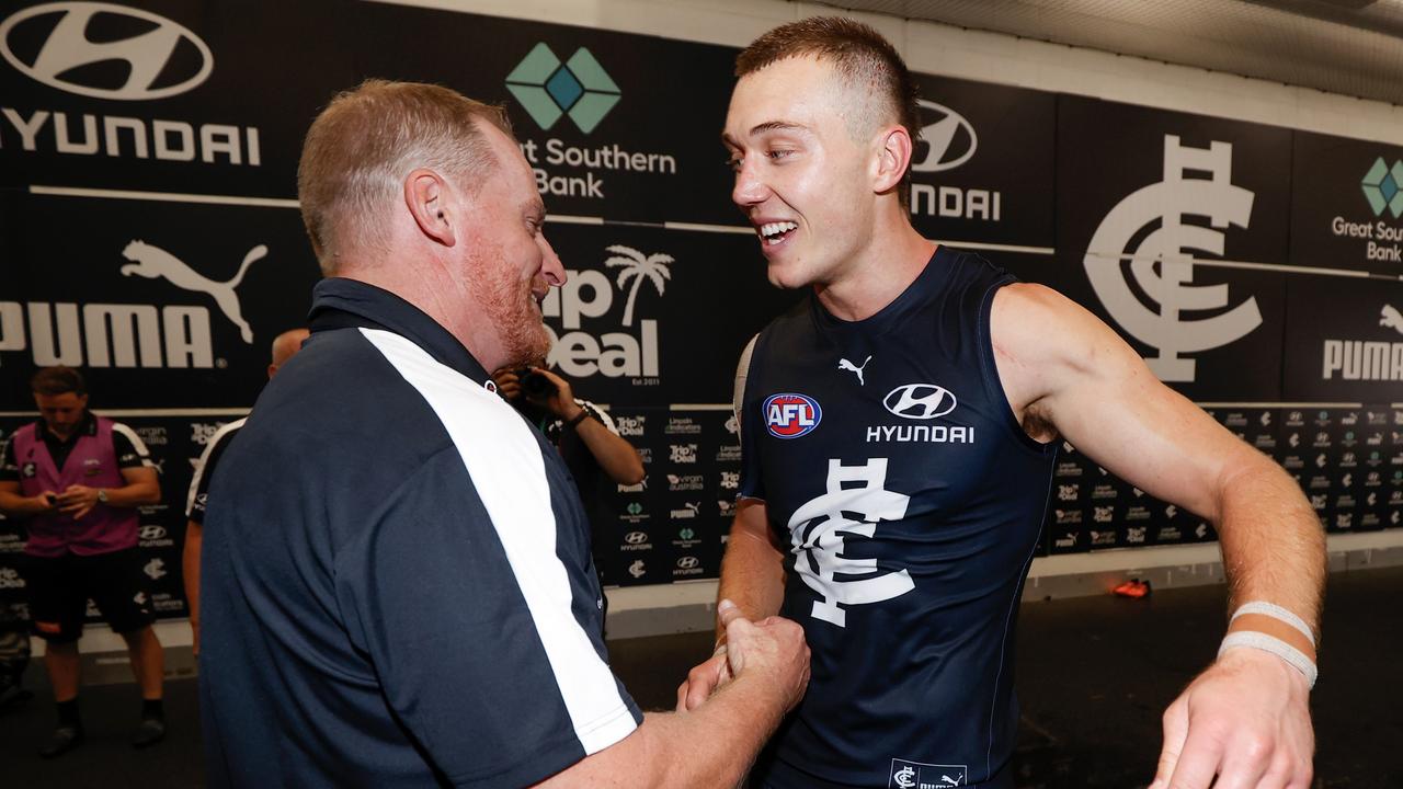 Carlton coach Michael Voss celebrates with skipper Patrick Cripps.