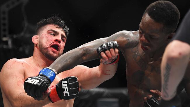 Israel Adesanya punches Kelvin Gastelum. Picture: Logan Riely/Getty Images/AFP