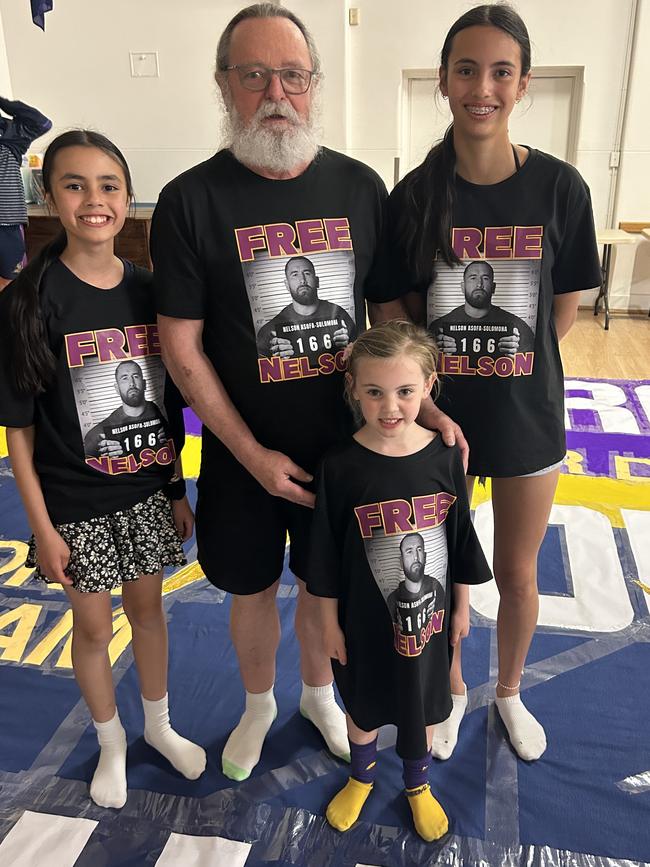 Melbourne Storm banner crew leader Lance Maguire with grandchildren Miki, Lulu and Maddy. Picture: Shannon Gill