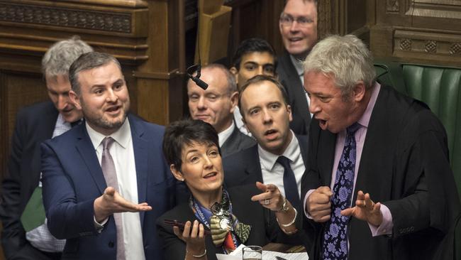 Tory MPs urge British Speaker John Bercow, right, to review a video clip showing Jeremy Corbyn muttering remarks during question time yesterday. Picture: AP