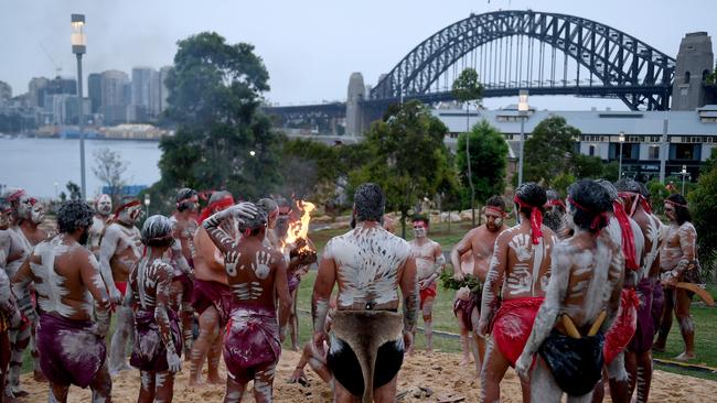 Representatives of Aboriginal groups from around Australia perform the Smoking Ceremony and Dance during the WugulOra Morning Ceremony. (AAP Image/Brendan Esposito)