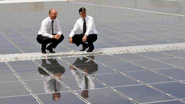 File pic of the Adelaide Showgrounds installation with venue manager Jason Hemingway and chief executive John Rothwell on the roof of the Goyder Pavilion with the solar panels.