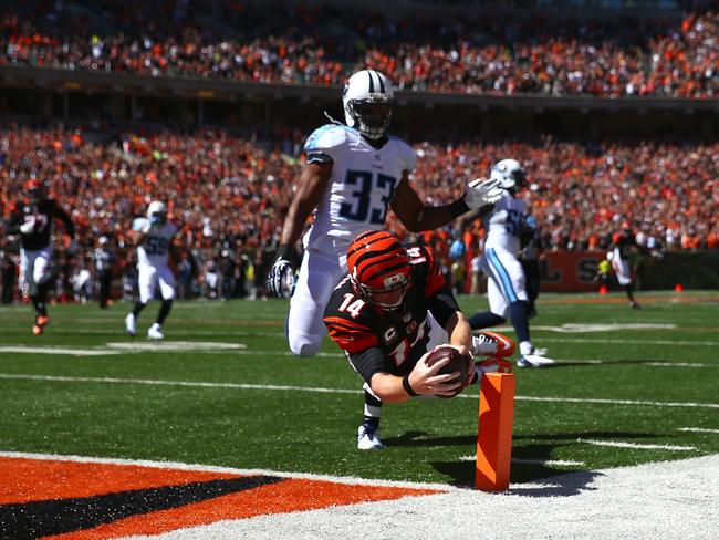 Andy Dalton #14 of the Cincinnati Bengals dives into the end zone to score a touchdown.