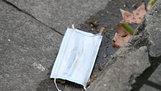 The number of discarded masks has raised the ire of one resident, though the gutter mask can often be a blessing in disguise for someone who forgot to bring one to the shops. Picture: NCA NewsWire / Naomi Jellicoe