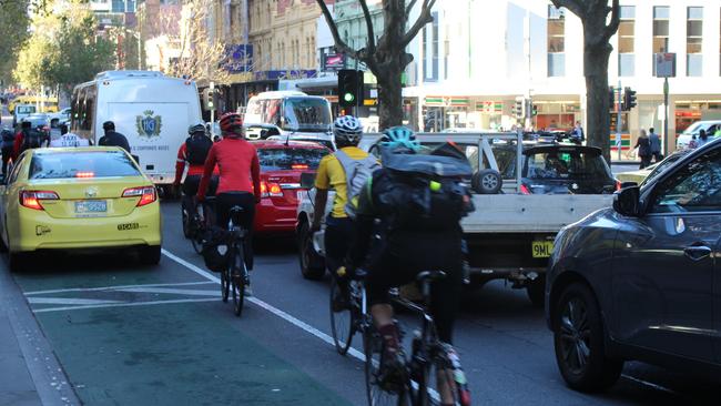 Vehicles parked in a bike lane on Exhibition St, Melbourne.