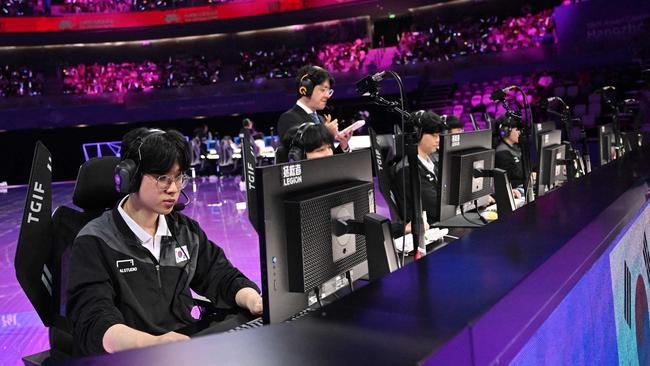 (FILES) South Koreaâ&#128;&#153;s team prepare to compete in the Esports League of Legends final match between South Korea and Taiwan during the Hangzhou 2022 Asian Games in Hangzhou in ChinaÃ­s eastern Zhejiang province on September 29, 2023. (Photo by ADEK BERRY / AFP)