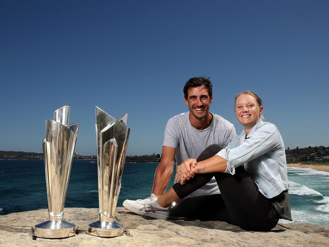 Two of a kind … cricket power couple Mitchell Starc and Alyssa Healy with the Women's and Men's ICC T20 World Cup trophies.