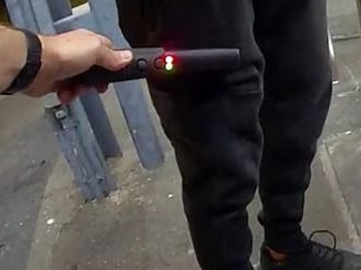 Supplied image of Queensland Police  a metal detecting wand  on a member of the public. NSW is set to introduce legislation to Parliament to follow the Queensland model to cut down on knife crime.