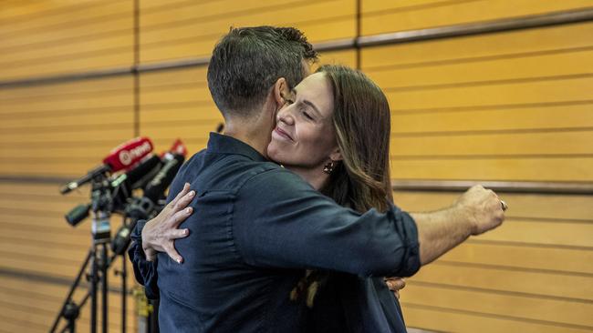 Former New Zealand Prime Minister Jacinda Ardern hugs her fiancee Clark Gayford after announcing that she will not be seeking re-election.