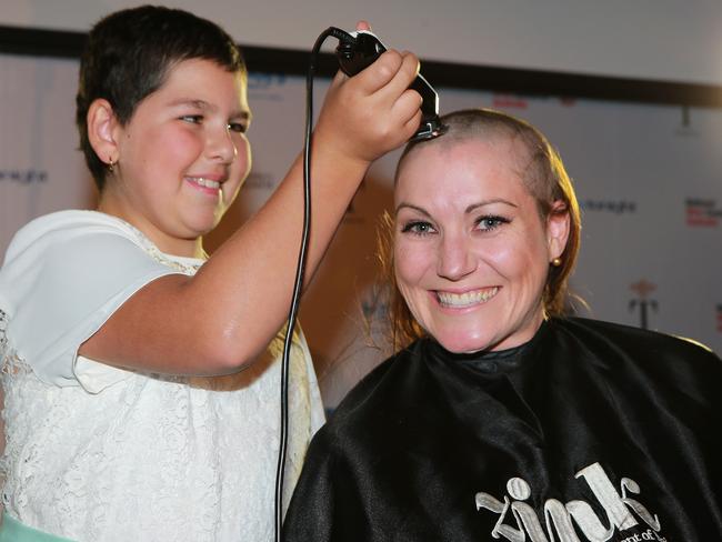 Anna Meares has her head shaved by leukaemia survivor Jessica Simone. Picture: Dylan Coker