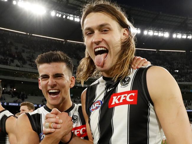 MELBOURNE, AUSTRALIA - AUGUST 21: Nick Daicos of the Magpies and Darcy Moore of the Magpies celebrate during the 2022 AFL Round 23 match between the Carlton Blues and the Collingwood Magpies at the Melbourne Cricket Ground on August 21, 2022 in Melbourne, Australia. (Photo by Dylan Burns/AFL Photos via Getty Images)