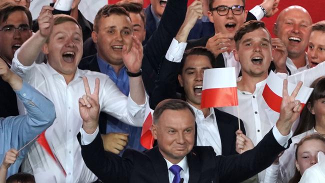 Polish President Andrzej Duda flashes V-signs after addressing supporters. Picture: AFP