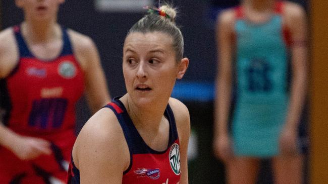 HOBART Sunday 16th June 2024. Tasmanian Netball League. Karana vs Devon at Hobart Netball Centre. Holly McConnon looks to pass for Karana Flames.Picture: Linda Higginson